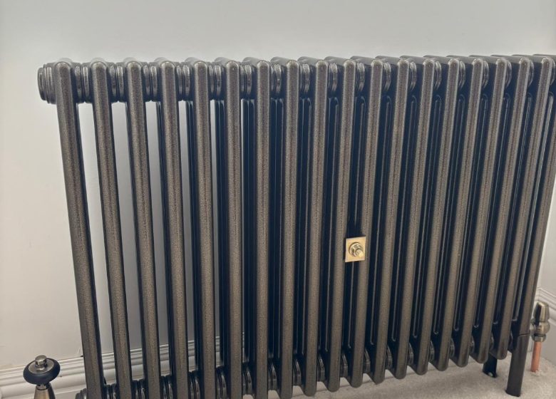 Anthracite column radiator fitted by Phillips Maintenance & Plumbing